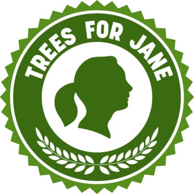 round green logo with title Trees for Jane with a silhouette of Jane Goodall in the middle