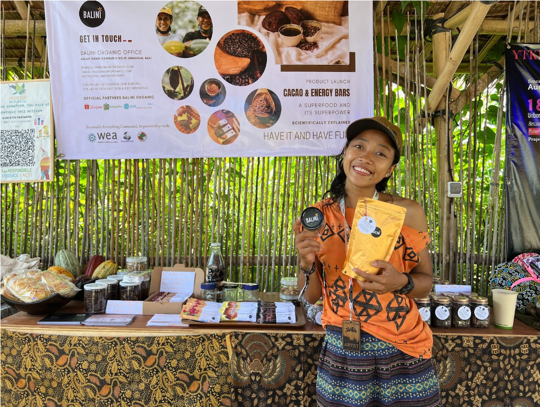 WEA Leader Tya Sari at an expo presenting Balini Organic's energy bars, a project supported by WEA.