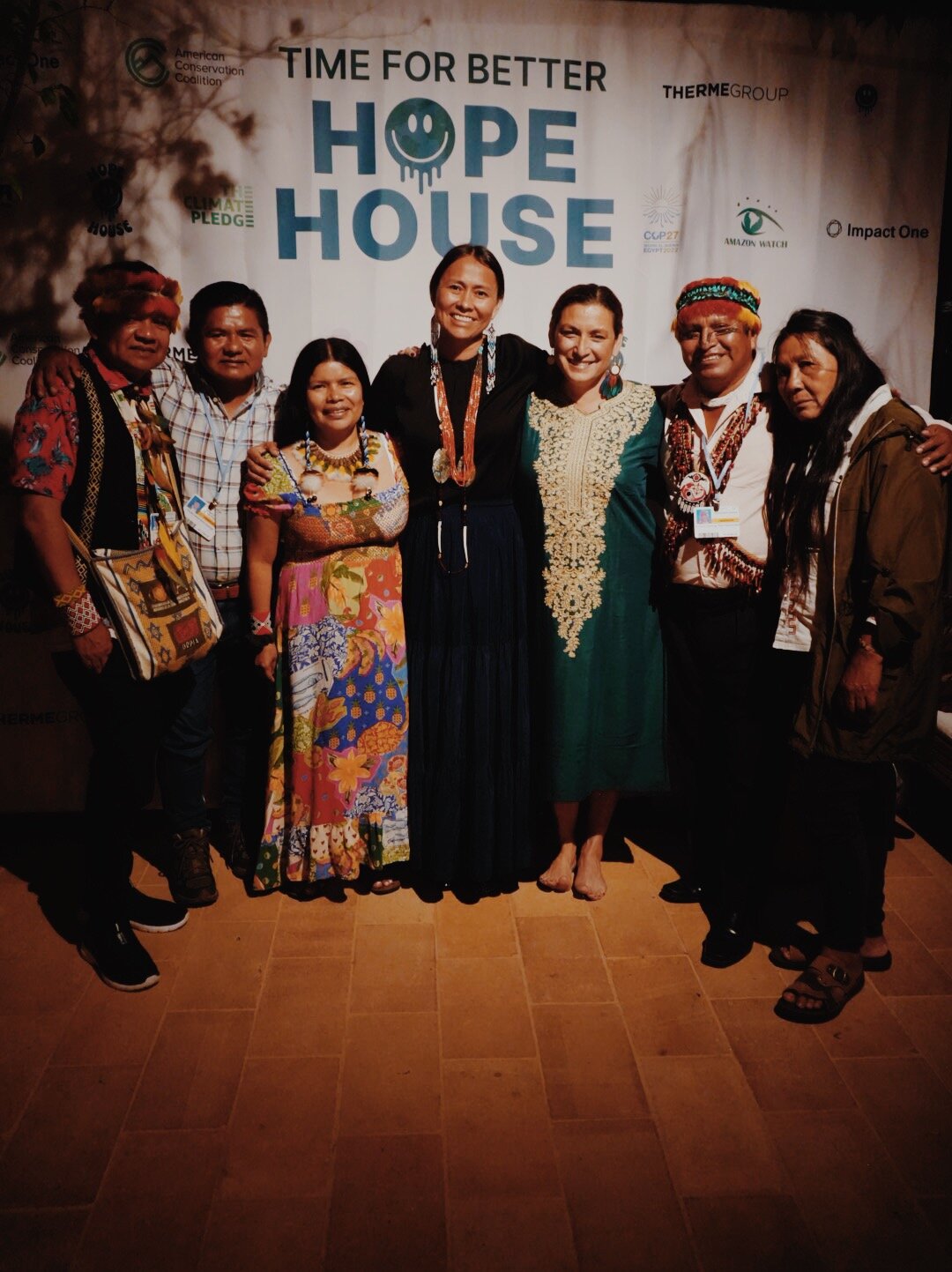 Leaders from Cultural Survival and Amazon Watch stand together with former WEA International Advisory Council member Wahleah Johns, Director of the U.S. Dept. of Energy, at a Hope House event. Credit: Bertold Weisner