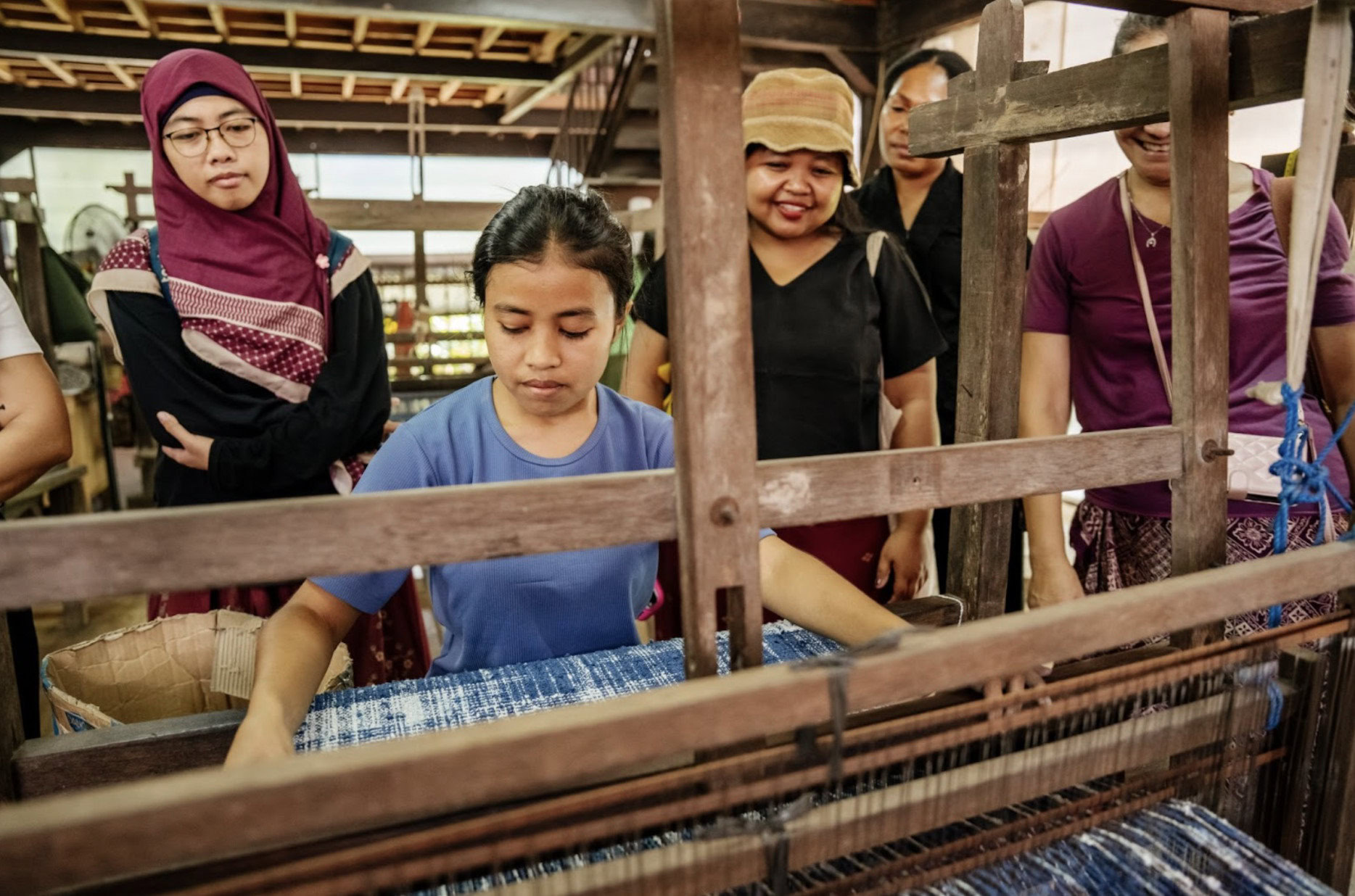 Aziza Nurul Amanah; Kris Mheilda Setiawati ; Mince Oyaitou; Gita Noerwardhani  learned about natural dye textile weaving production from Tarum Bali. Photo by: Prema Ananda.