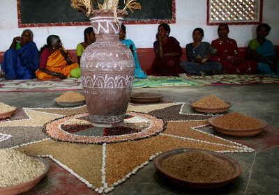 Women farmers displaying indigenous seeds that they save at a community seed bank in Karnataka.