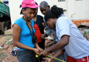 Nansubuga Immaculate (in pink hat) at the 2011 GWWI Training in Uganda.