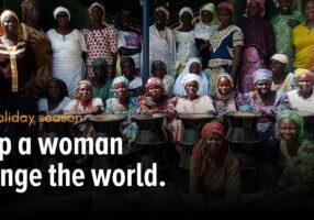 help a woman change the world banner